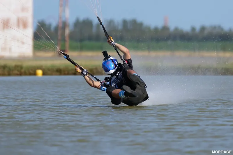 Marcos dragging his feet through the water on a swoop