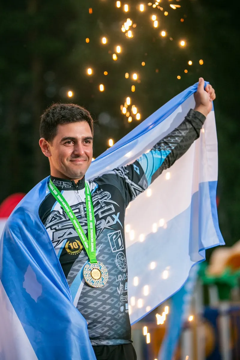 Marcos Darman wrapped in the Argentine flag with his gold medal, 2021 FAI World Championship