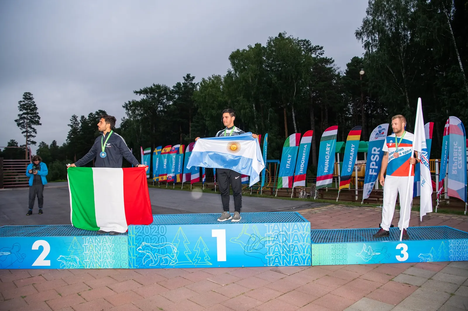 Marcos Darman with the Argentine flag on top of the podium, 2021 FAI World Championship of Canopy Piloting speed event